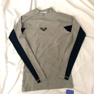 Brand new, never been worn-  Roxy rash guard
